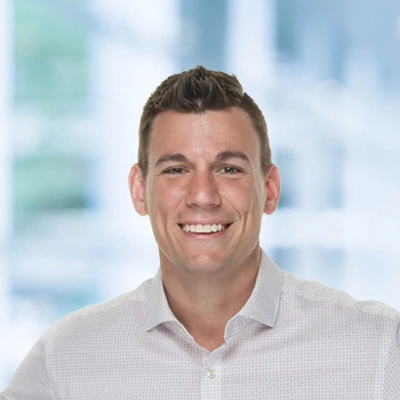 Dr. Brandon Larabee portrait, wearing a white shirt and smilling